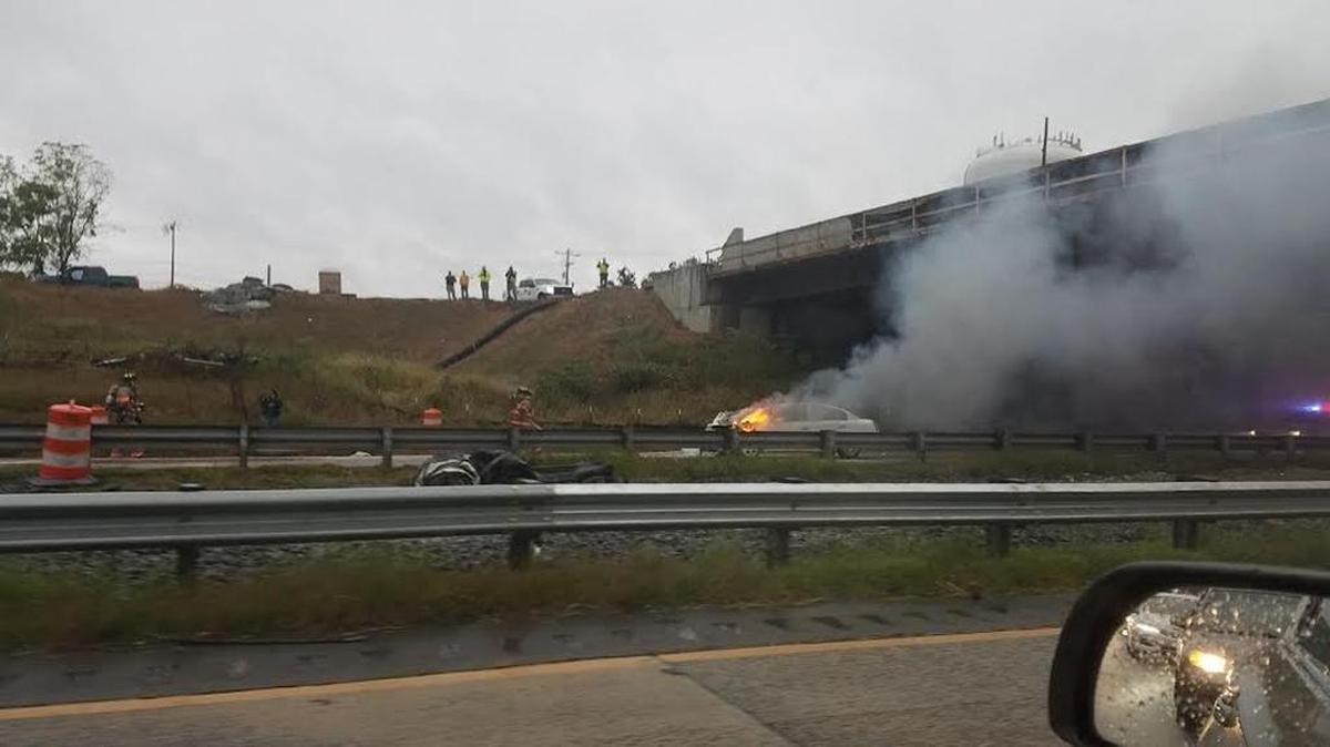 A car burns after an accident Tuesday morning on N.C. 147.