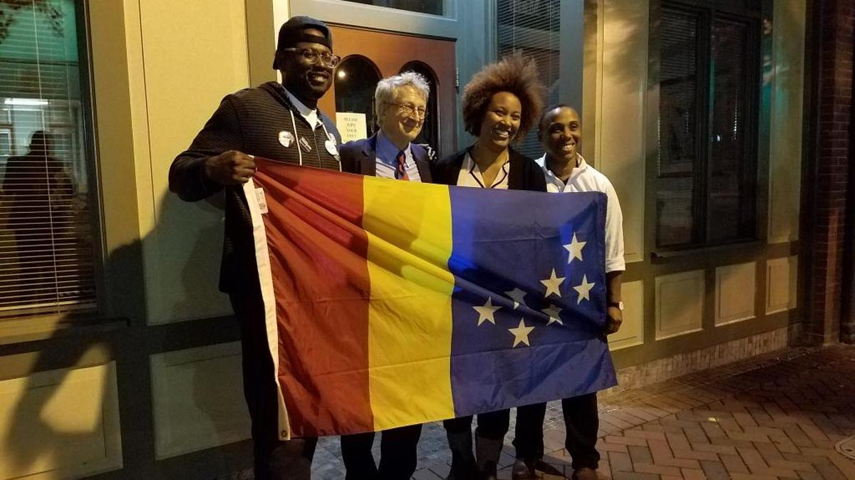 People's Alliance candidates celebrate outside 106 Main on election night Nov. 7, 2017. DeDreana Freeman, third from left, won the Ward 1 Durham City Council seat, defeating incumbent Cora Cole-McFadden. Also pictured are, from left, John Rooks Jr., who lost his Ward 2 race, mayor-elect Steve Schewel and the Ward 3 winner Vernetta Alston.