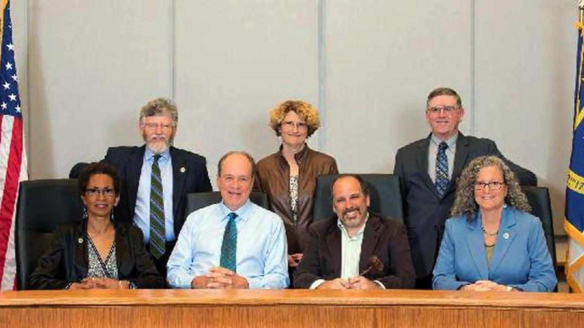 The Orange County Board of Commissioners – from left, Renee Price, Barry Jacobs, Mark Marcoplos, Mia Burroughs, Chairman Mark Dorosin, Earl McKee and Vice Chairwoman Penny Rich – dropped a plan to reduce the school district tax rate Tuesday before approving the 2017-18 budget.