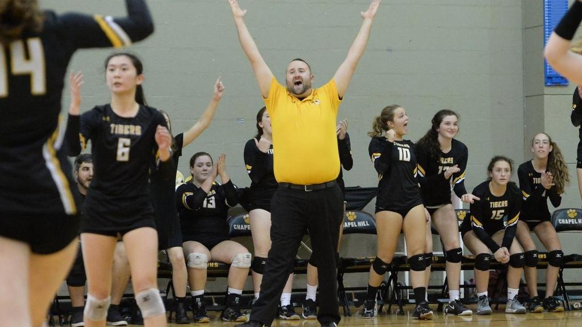 Chapel Hill High School coach Ross Fields (center) has his team back in the 3-A state volleyball championship match. The Tigers will play North Iredell at N.C. State’s Reynolds Coliseum on Saturday (5 p.m.).