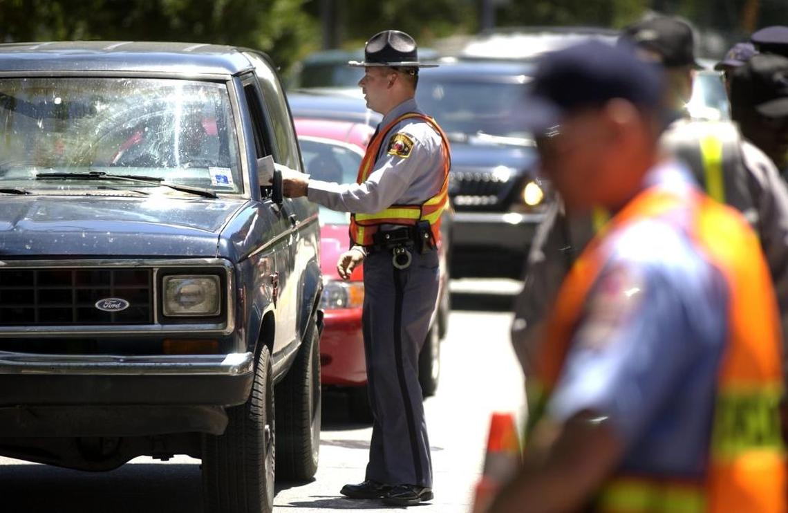 North Carolina Deptartment of Motor Vehicles officers operate a “Click It or Ticket” checkpoint in this 2002 file photo.