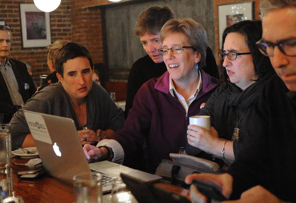 Carrboro Mayor Lydia Lavelle (center) joins supporters to watch the results come at the B-Side Lounge in Carr Mill Mall in Carrboro Tuesday, Nov. 7, 2017.