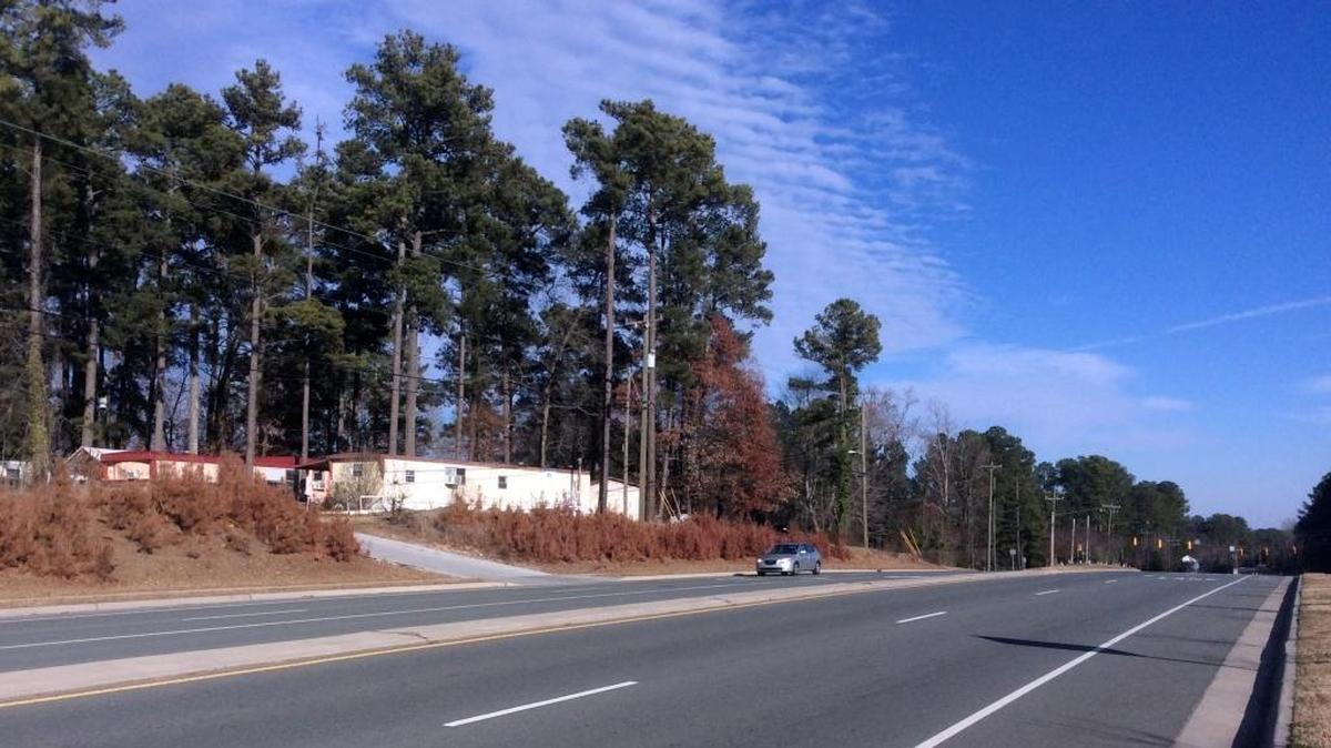 The Lakeview Mobile Home Park on Weaver Dairy Road is located directly across the street from the Timberlyne shopping center and surrounded by retail, offices and new apartments. A Houston-based developer wants to build 303 apartments and townhomes on the site and adjacent parcels.