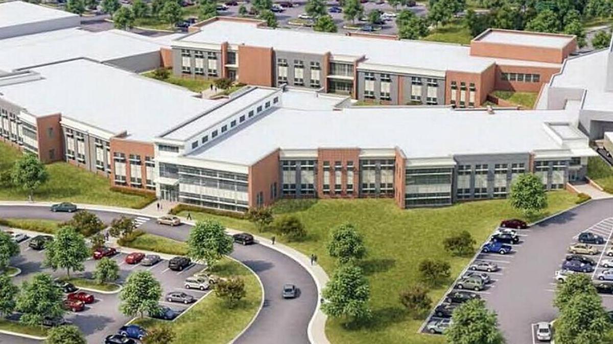 Chapel Hill-Carrboro City Schools officials say Triangle construction cost increases could add another $20 million to a plan to renovate and rebuild parts of Chapel Hill High School (pictured in this artist’s rendering).