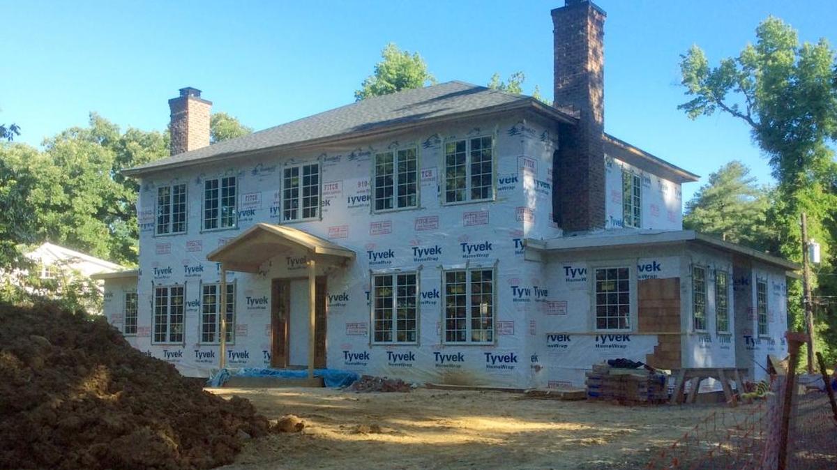 Construction is underway this spring at 704 Gimghoul Road, where new owners Bob and Virginia Buysse are building a new, two-story home reminiscent of the former home’s architectural style and size.