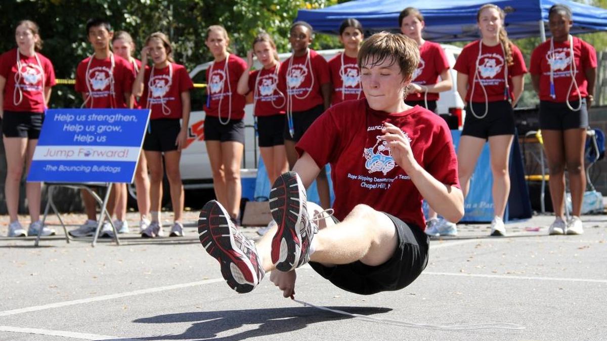 “It’s a lot of fun, but it’s also a lot more than jumping rope,” Bouncing Bulldog Adam Weston, then 15, said at Chapel Hill’s 2013 Festifall street fair, after demonstrating a trick move of passing the the rope under his body while bouncing on the ground. “It’s leadership, it’s teaching skills, and it helps you prepare for a world after high school.”