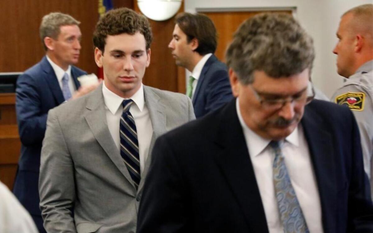 Former UNC student Chandler Kania, of Asheboro, left, follows his father Michael Kania as they exit Orange County Superior Court in Hillsborough on Aug. 16, 2016. Kania is serving 16 years in prison for a DWI crash in July 2015 that killed three people and injured a fourth.
