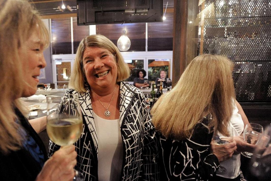 Chapel Hill Mayor Pam Hemminger (center) celebrates with supporters at City Kitchen restaurant in University Place in Chapel Hill after being elected to a second term Tuesday, Nov. 7, 2017.