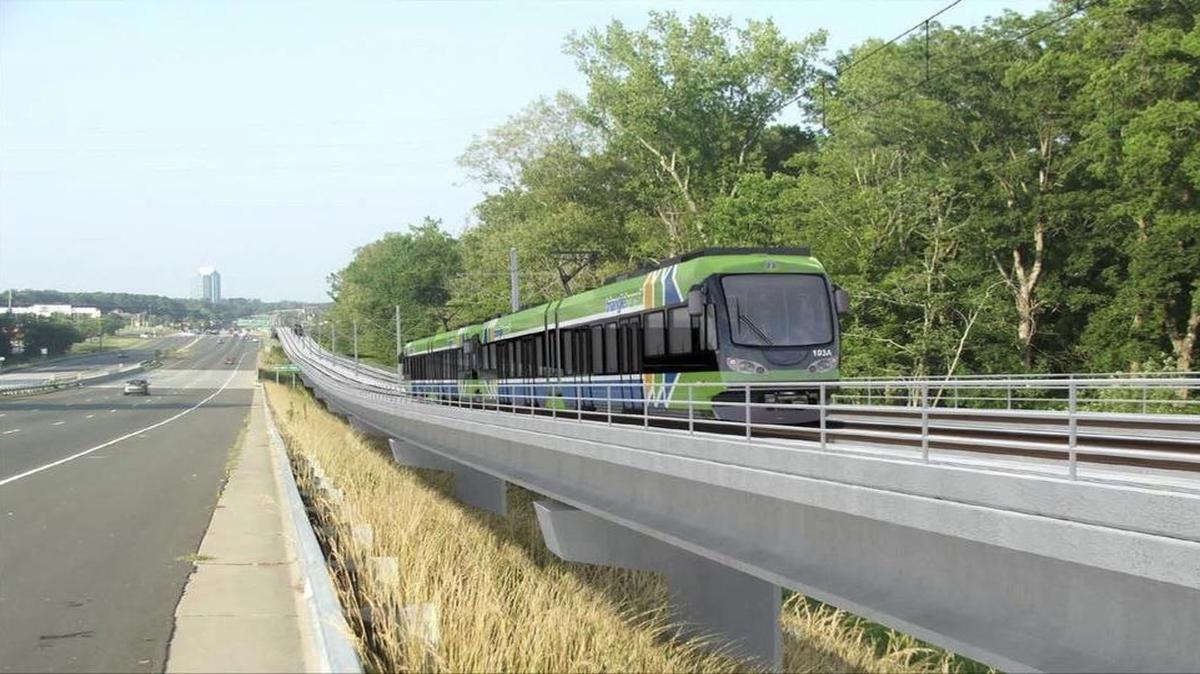 An artist’s rendering of a light-rail train running beside U.S. 15-501 over New Hope Creek in Durham.