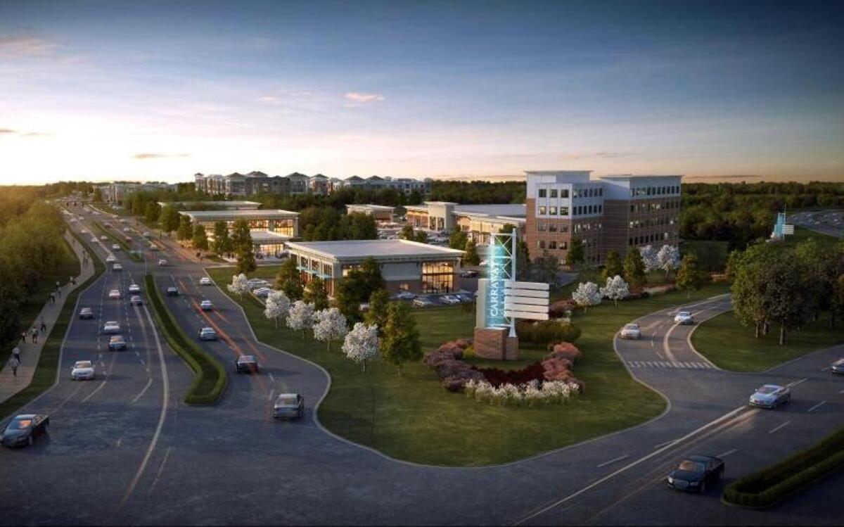 A project rendering shows the future Carraway Village mixed-use community from the intersection of Eubanks Road, N.C. 86 and Interstate 40. The project will widen Eubanks Road, adding bicycle lanes and sidewalks, and create new intersections.