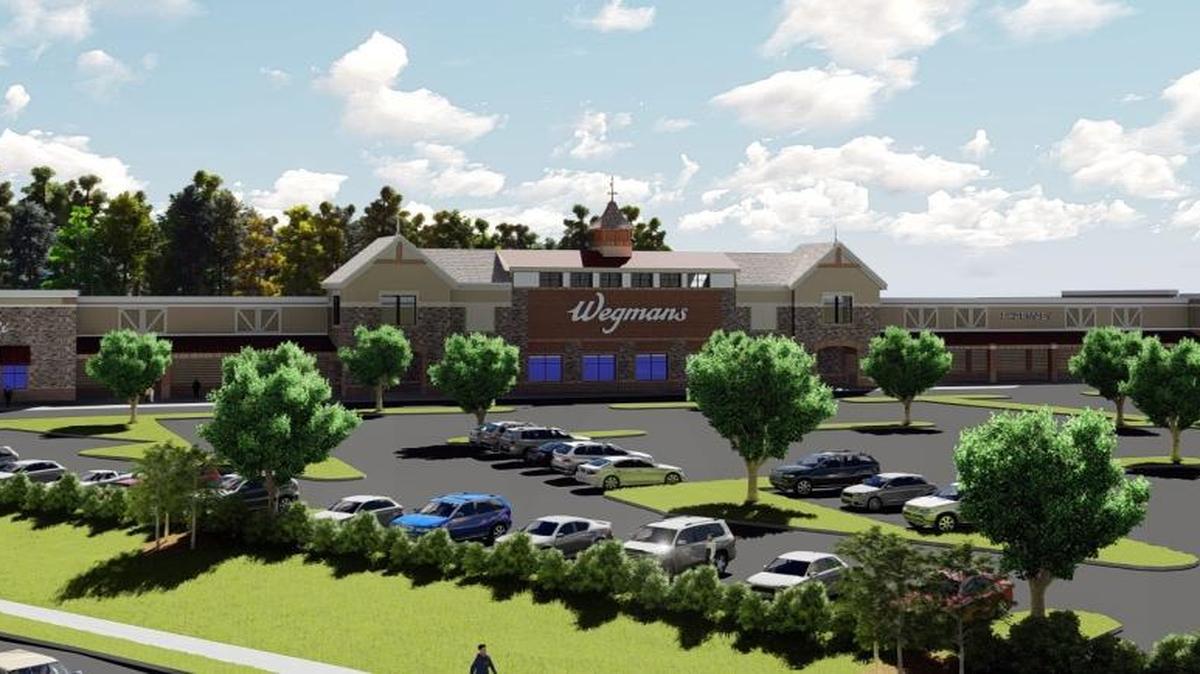 An artist’s rendering shows Wegmans Food Market as it would be seen from U.S. 15-501 near the Hardee’s restaurant on Old Durham Road in Chapel Hill. The Town Council could vote on the proposed 130,000-square-foot store in October.