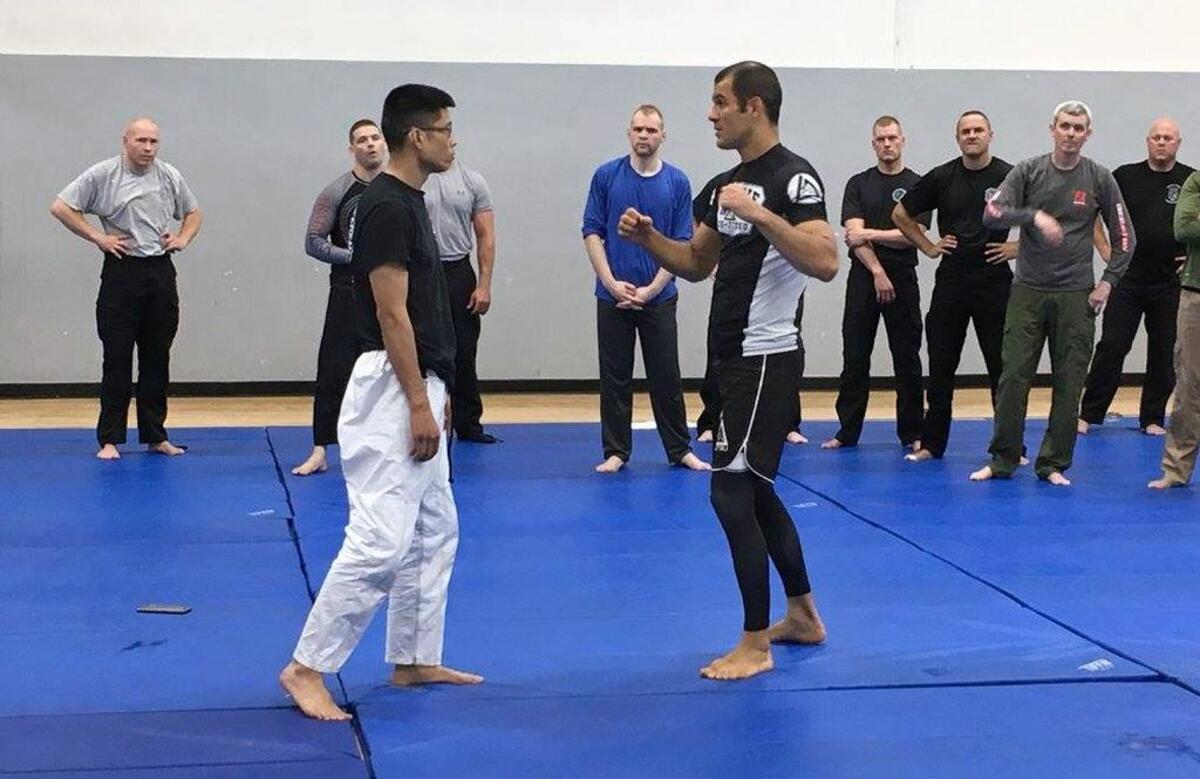 Ryron Gracie, at right, with Gracie Academy in Torrance, California, and Sunny Yu, owner of Gracie Durham Jiu Jitsu Academy in Durham, demonstrate a Jiu-Jitsu technique for law enforcement officers in May at a weeklong training session in Raleigh.