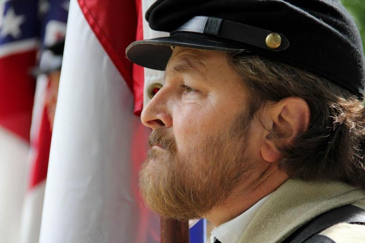 "My people have been in Orange County since 1750. It's a piece of me," says William O'Quinn, post commander of the Durham Sons of Confederate Veterans Camp, seen in soldie’s garb at the statue May 5, 2012. "I don't understand people today. Most people don't know their grandparents."