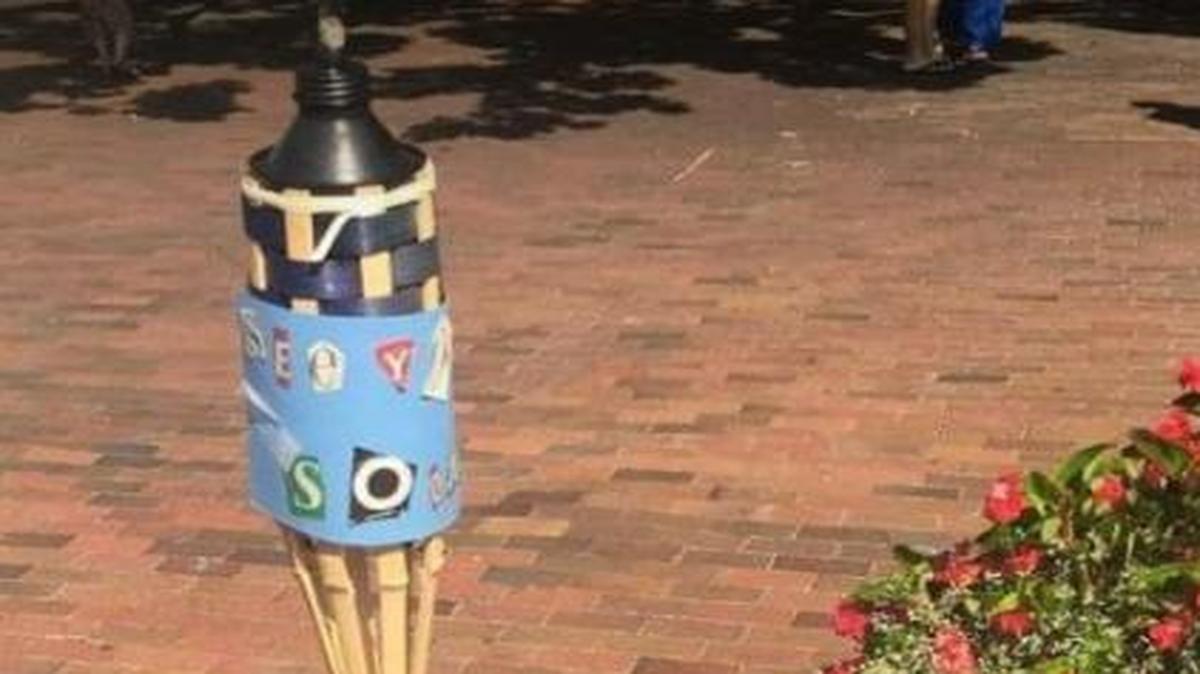 A Facebook post showing a tiki torch planted on the UNC-Chapel Hill campus.
