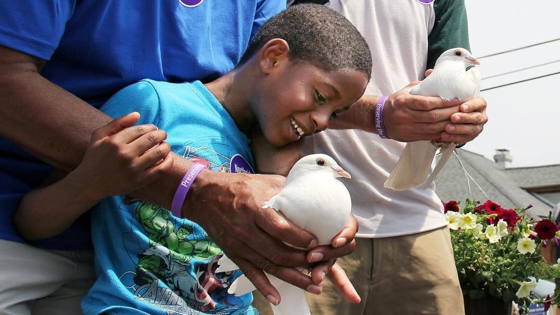 Jamare Lee, 6, great grandson of Marian Cheek Jackson, namesake of the Marian Cheek Jackson Center in Chapel Hill, prepares to release a white dove Saturday, April 29, 2017, at the Northside Festival, celebrating the town's historically black Northside neighborhoods. The festival featured the dedication of a new "gateway," a series of photographs embedded in a stone wall outside St. Joseph C.M.E. Church documenting Chapel Hill’s Freedom Fighters and scenes of civil rights marches. "It really helps to tell (the story that) Chapel Hill was not and, to a lesser degree is not, what we think it is," Town Council member Michael Parker said Saturday.