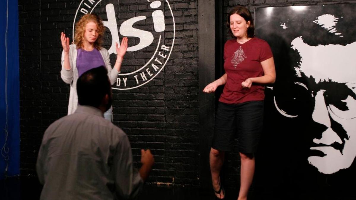 DSI Comedy founder and artistic director Zach Ward asks improv students Zena Cardman, left, of Carrboro and Nathania Johnson of Raleigh to close their eyes and visualize the scenario in this 2014 file photo.