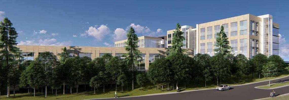 An architect’s rendering shows how two six-story buildings and a parking deck would look from Eastowne Drive, behind the UNC Health Care campus.