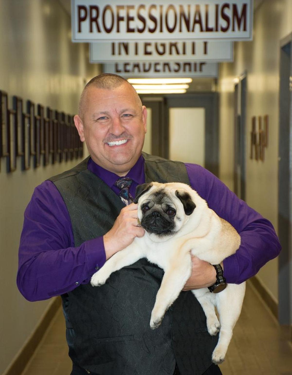 Chatham County Sheriff Mike Roberson holds Biggie.