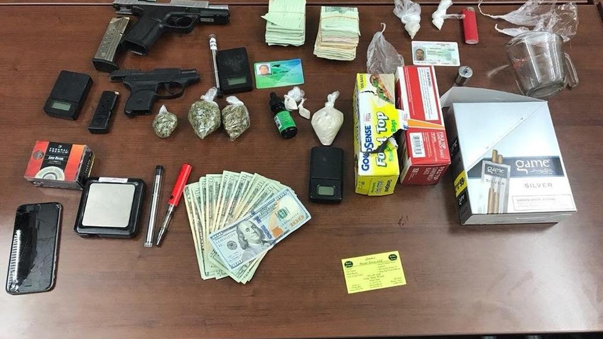 Items seized during a Durham County Sheriff’s Office narcotic team search of a home on East Club Street Friday, July 21, 2017.