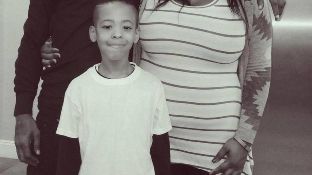 Kamari Munerlyn, middle, with his father Theo Munerlyn and aunt Mika Mitchell in this photograph from 2015. Courtesy of family