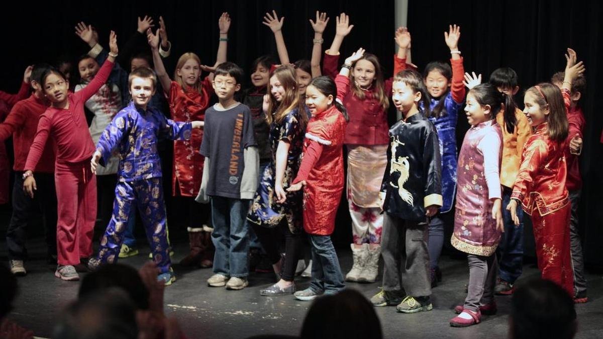 Glenwood Elementary Mandarin/English 4th grade students perform a song welcoming the 2014 Chinese New Year, the year of the horse, at the Seymour Senior Center in Chapel Hill in this Feb. 3, 2014 file photo.