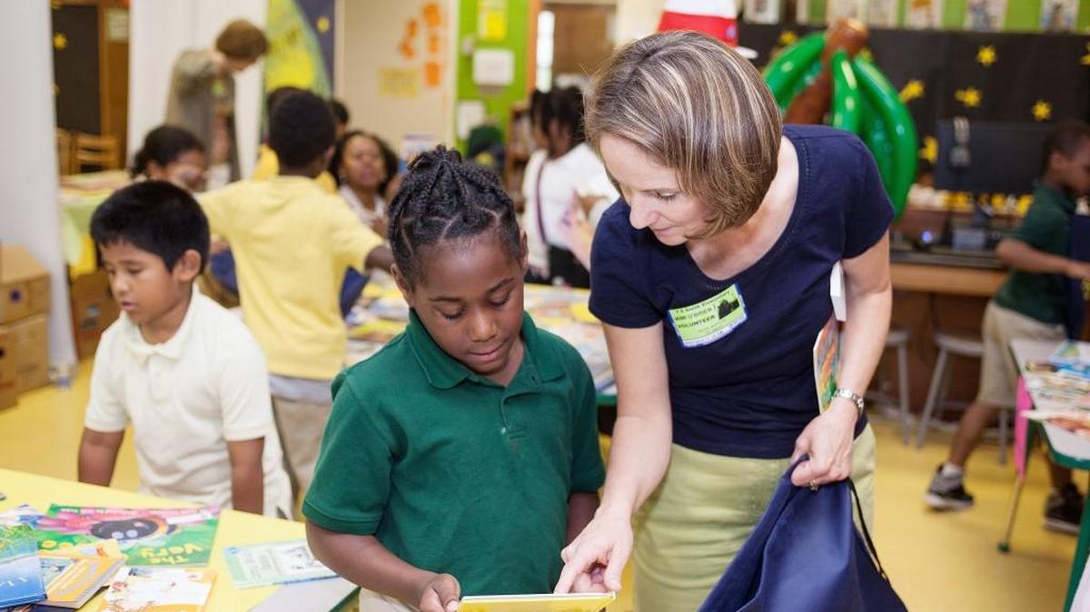 At Book Harvest's Books on Break event at Y.E. Smith Elementary School in May 2015, children select books to take home and keep, to help build home libraries and combat summer learning loss.