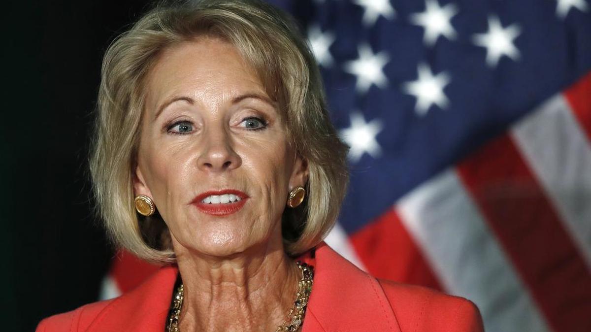 In this Sept. 7, 2017, file photo, Education Secretary Betsy DeVos speaks at George Mason University Arlington, Va., campus. Students who attended for-profit colleges were twice as likely or more to default on their loans than students who attended public schools, according to a new federal study. The report comes as Education Secretary Betsy DeVos rewrites rules that had been put in place by the Obama administration to protect students who said they were defrauded by their for-profit colleges.