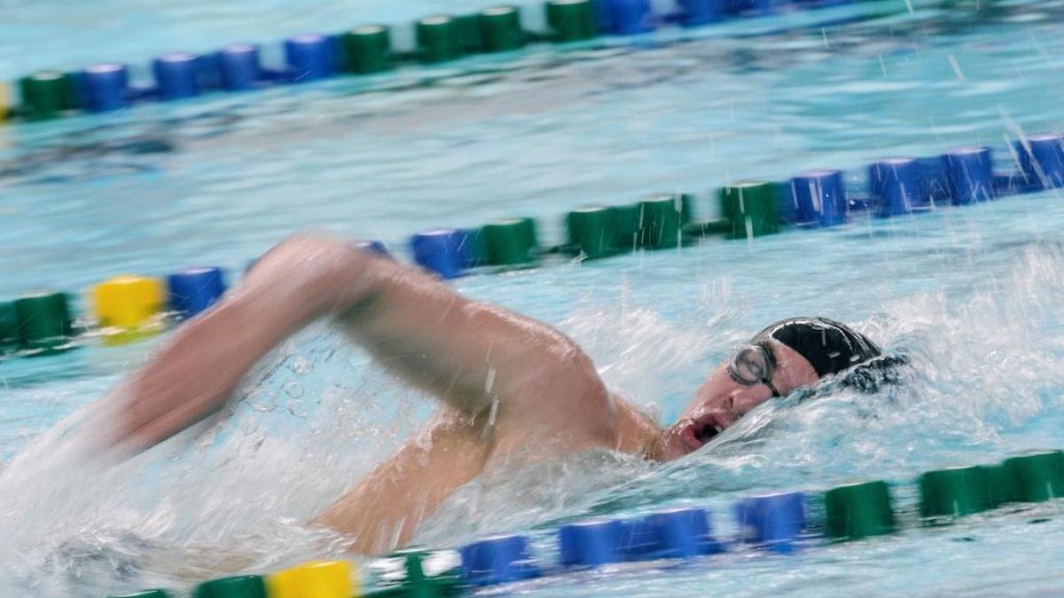 In this Tuesday, Nov. 21, 2017 photo, Columbus North sophomore Nick Green competes in the 500-yard freestyle during a swim meet against Franklin at Columbus North High School in Columbus, Ind.. Green was diagnosed with osteochondritis dissecans right before the start of his freshman season and had surgery in March 2017 after the season was over.