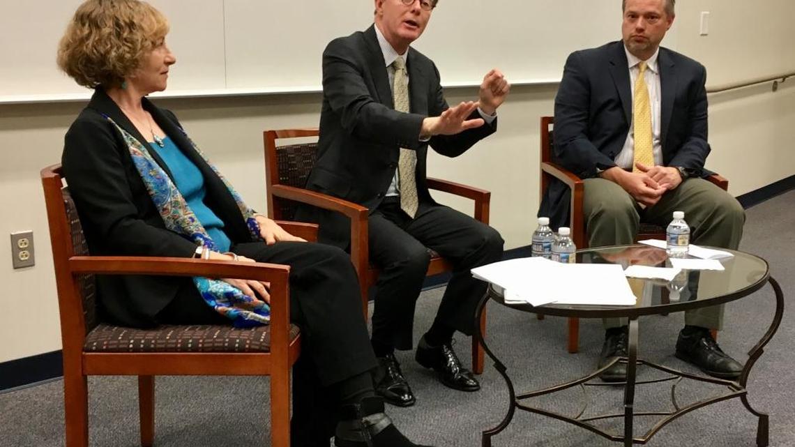 Incoming Duke University President Vince Price (center) answers a question during a special getting-acquainted meeting Thursday with Duke's Academic Council. He's flanked on the left by the council's chairwoman, engineering professor Nan Jokerst, and on the right by its chairman-elect, public policy professor Don Taylor.