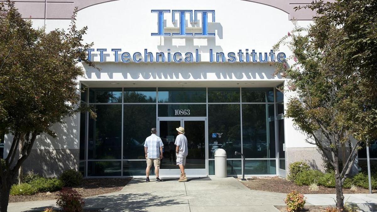 In this Sept. 6, 2016, file photo, Harold Poling, left, and Ted Weisenberger check the doors to the ITT Technical Institute after ITT Educational Services announced that the school had ceased operating in Rancho Cordova, Calif. The U.S. Education Department has not approved any applications for student-loan forgiveness in cases of possible fraud since President Donald Trump took office, according to records sent to an Illinois senator. The records also revealed that the department has continued to receive new applications from borrowers who say they were victims of fraud, mostly from Corinthian borrowers and from former students of ITT Technical Institute.