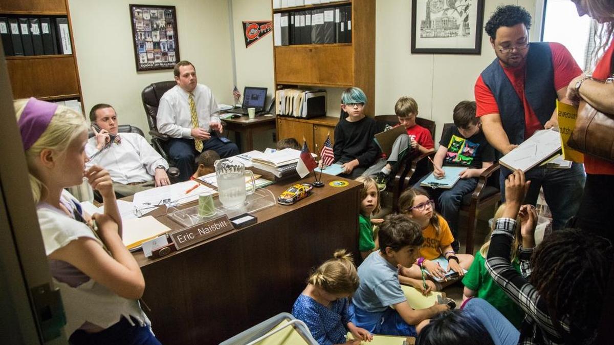 Durham elementary school students, teachers and parents hold an art lesson and protest inside Sen. Chad Barefoot’s office in the Legislative Office Building in Raleigh on May 3, 2017 to ask state lawmakers to increase education funding.