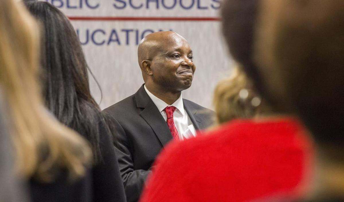 Pascal Mubenga receives applause after being sworn in as the new superintendent of Durham Public Schools in by District Court Judge Shamieka L. Rhinehart on Monday, Nov. 27, 2017, in Durham, NC.