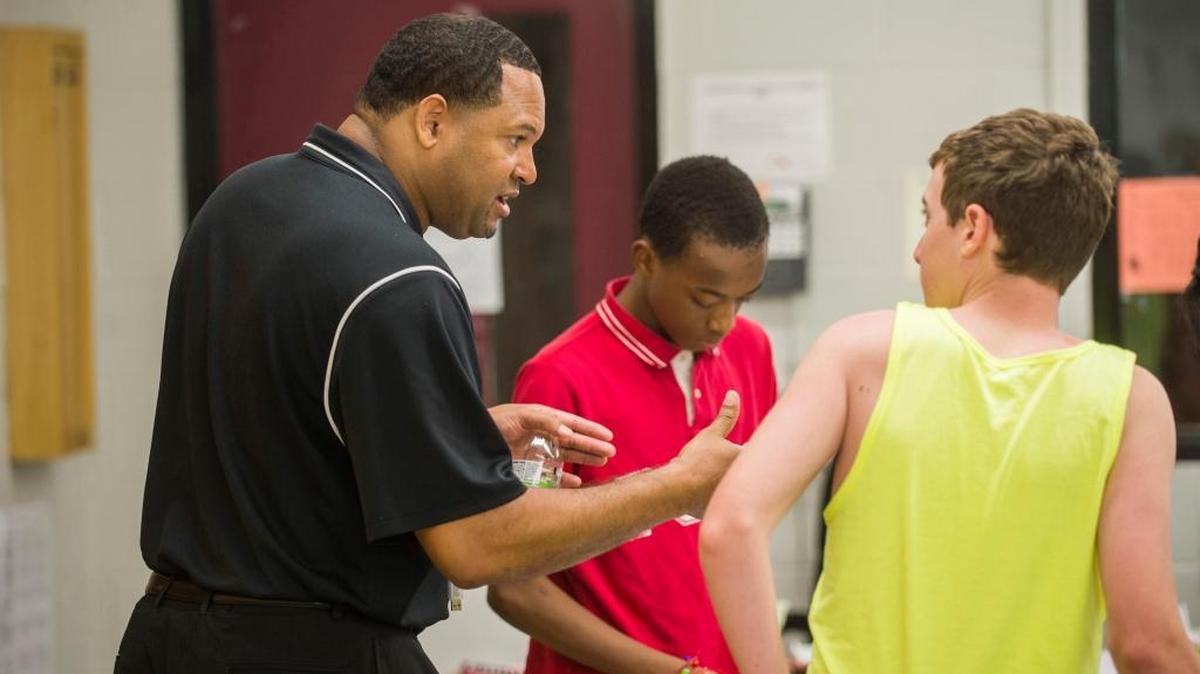 Derrick Booth, left, introduces himself to students, Adrian Pettis, center, and Isaac Bushnell in “WINNING,” an acronym for What I Need Now In Ninth Grade in Peoria, Ill. The program is part of the Peoria Public Schools Social and Emotional Learning Camp, where students entering ninth grade receive mentoring, training to deal with stress and introduction to a variety of careers. The group will be tracked through high school to gauge the advantages of the program.
