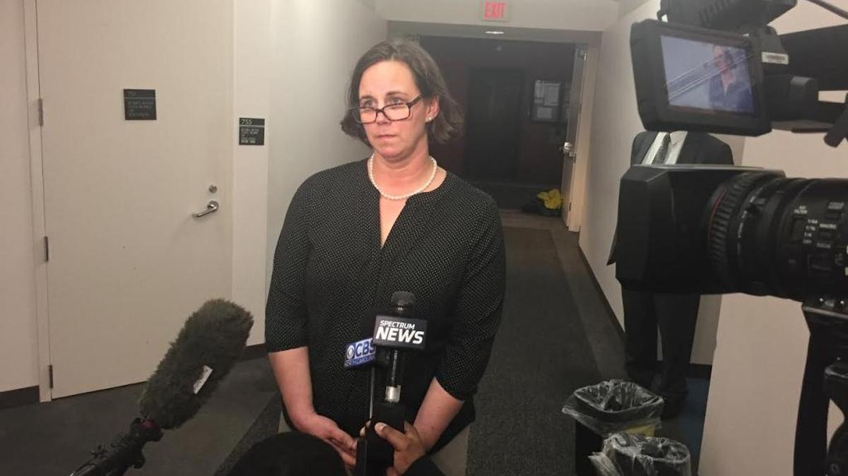 Glenna Boston, vice chairwoman of Kestrel Heights’ board and the parent of a fifth-grader at the school, talks to reporters Thursday, shortly after the State Board of Education upheld its decision to order Kestrel’s high school to close.