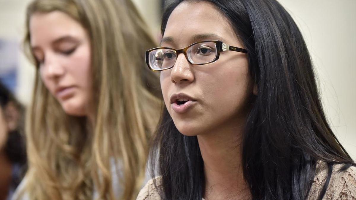 Penn Manor High School student Sameeha Hossain says, “I just think race is an uncomfortable topic,” said Hossain, 16, a junior whose parents are from Bangladesh. “But we’re in a small group, so I think it’s easier to talk about. I think that’s the first step.” Seated in the background is Atlana Groff.