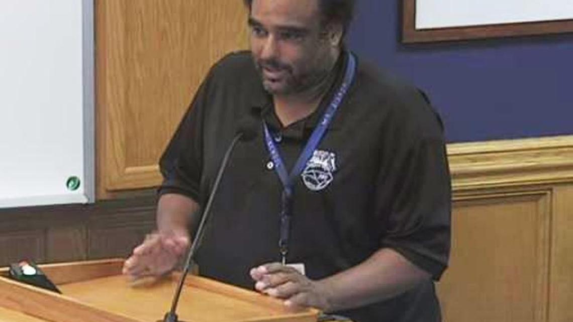 Theo Bishop, a veteran custodian who has worked at Hillandale Elementary School for more than 20 years, addresses the Durham Public Schools Board of Education.