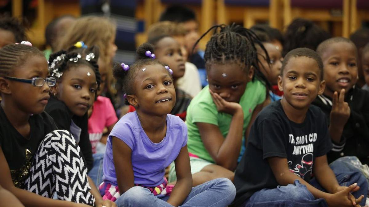 In this Sept. 24, 2015 photo, first grade children sit during class at Pineview Elementary School in Tallahassee, Fla., where the student population is 100 percent African-American.