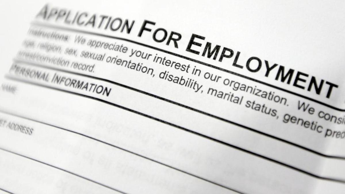 FILE - This April 22, 2014, file photo shows an employment application form on a table at a job fair in Hudson, N.Y. Middle-age white Americans with limited education are increasingly dying younger, on average, than other middle-age U.S. adults, a trend driven by their dwindling economic opportunities, research by two Princeton University economists has found. The economists, Anne Case and Angus Deaton, argue in a paper released Thursday, March 23, 2017, that the loss of steady middle-income jobs for those with high school degrees or less has triggered broad problems for this group.