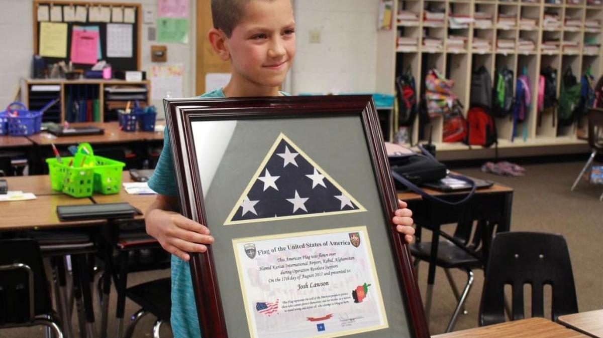 What began as a lesson in service has bridged a connection between Jeffersonville, Ind., elementary student Josh Lawson, pictured, and U.S. soldiers thousands of miles away.