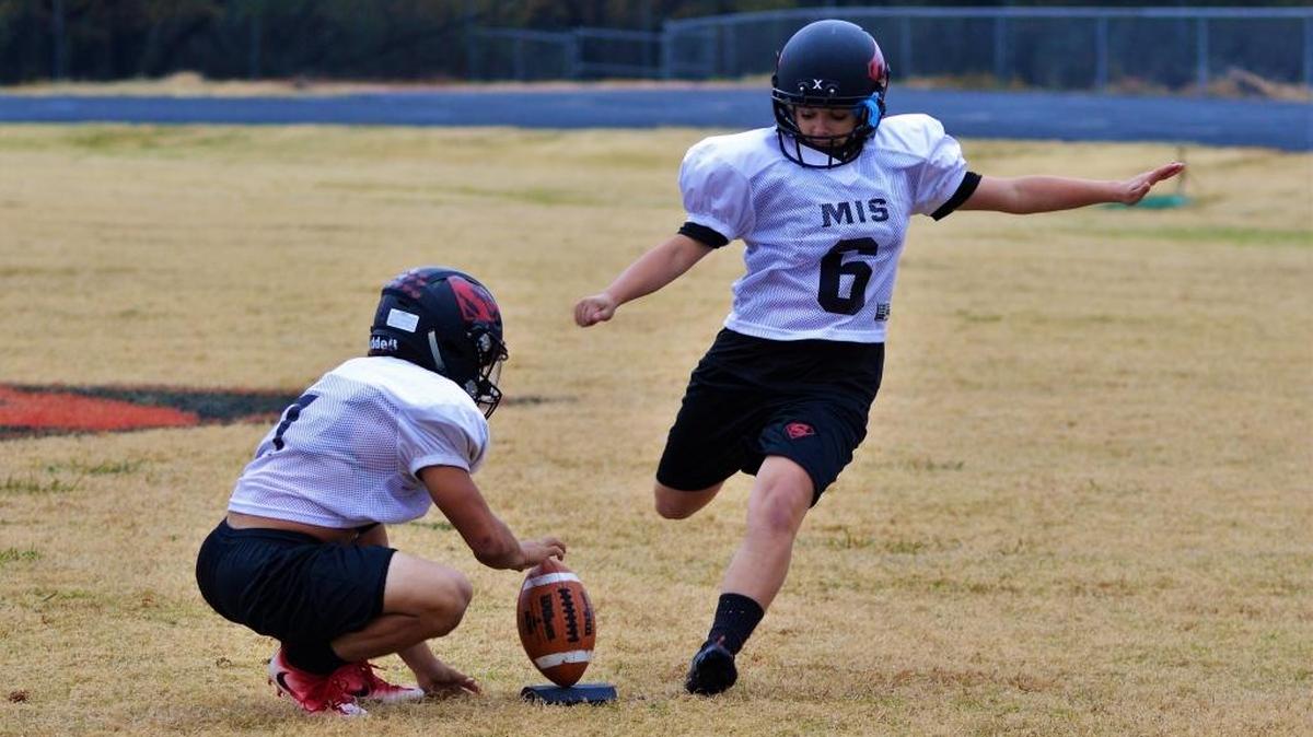 Strawn senior placekicker K-Lani Nava boots a practice field goal from 40 yards on Nov. 8, 2017 in Strawn, Texas. Nava connected on 63 of 74 PAT (extra point) attempts this year giving her 126 of her team's points in her team's first nine games. She routinely hits from 40 yards during practices.