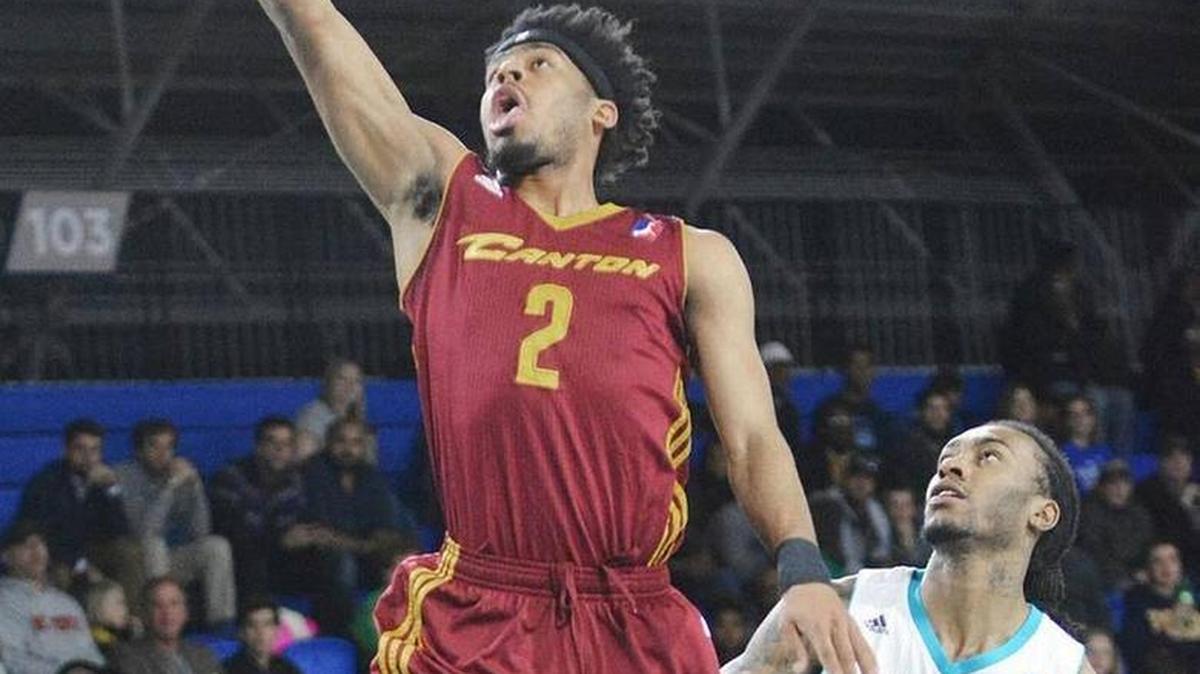Former Duke guard Quinn Cook shoots over former N.C. State guard Cat Barber on March 16.