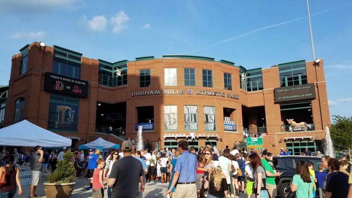 Fans head into the Durham Bulls Athletic Park before the game on April 15, 2017.