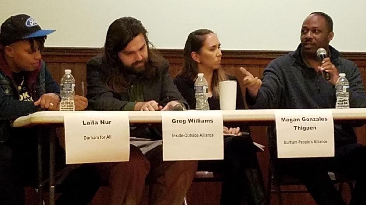 Henry McKoy of the Durham Committee on the Affairs of Black People, far right, makes a point while, from left, Laila Nur, Greg Williams and Magan Gonzales Thigpen listen during a panel discussion about “Pushing Past Progressive” Wednesday night.