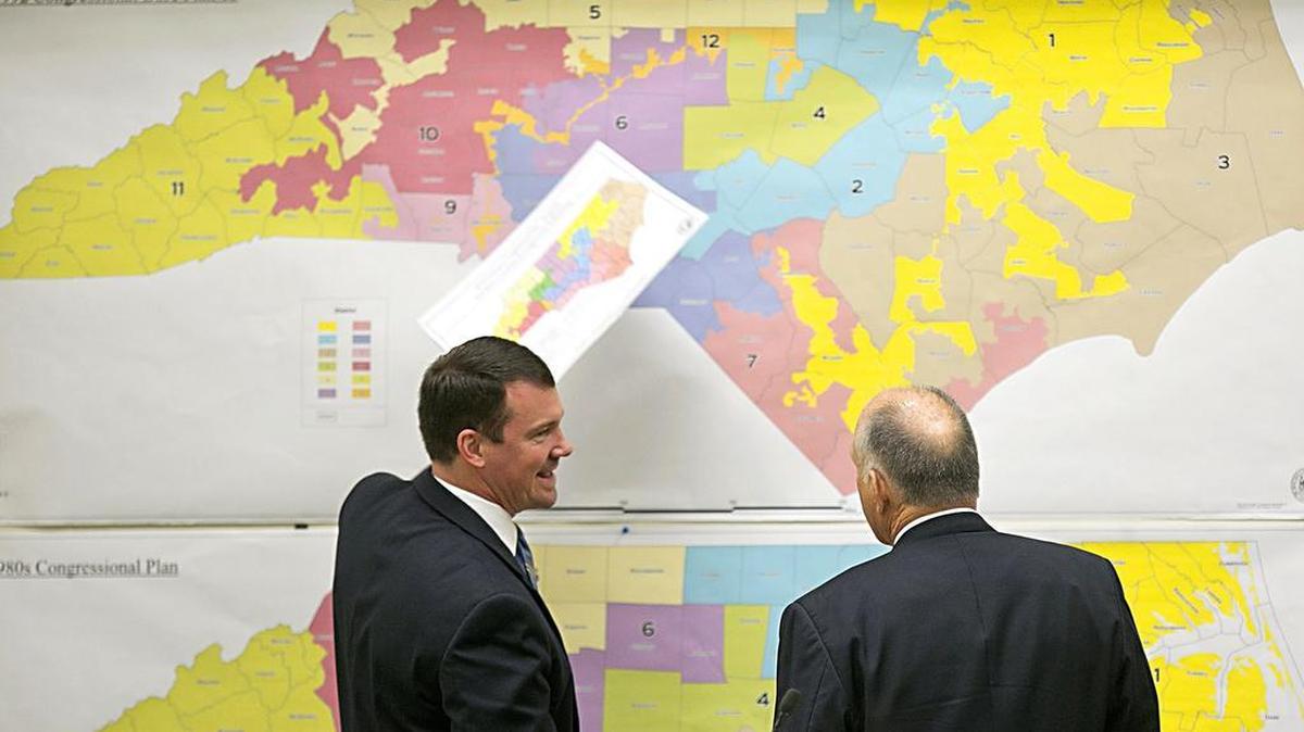 In this Tuesday, Feb. 16, 2016 file photo, N.C. Sens. Dan Soucek, left, and Brent Jackson, right, review historical maps during The Senate Redistricting Committee for the 2016 Extra Session in the Legislative Office Building in Raleigh.