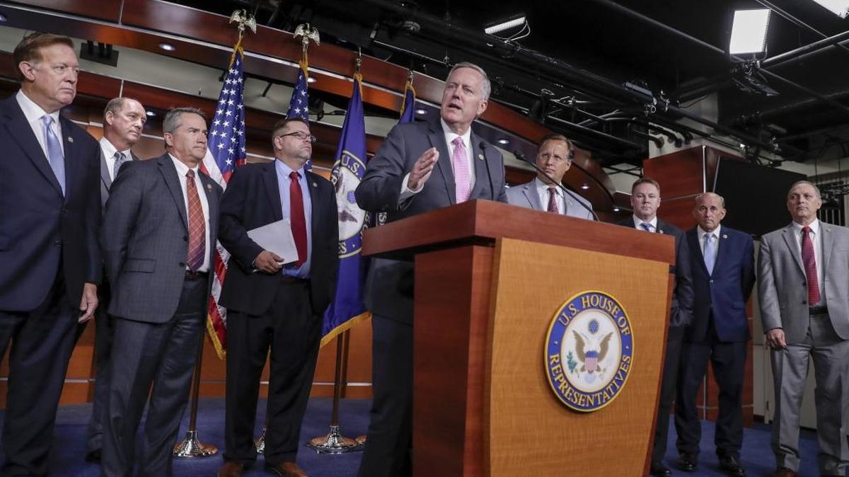 House Freedom Caucus Chairman Rep. Mark Meadows of North Carolina, center, speaks during a news conference on Capitol Hill in Washington on July 12, 2017, to say that his group wants to delay the traditional August recess until work is accomplished on health care, the debt ceiling and tax reform.