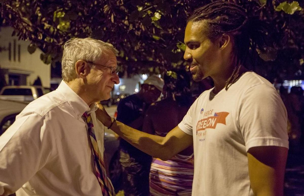 Durham mayoral candidate Steve Schewel, left, visits fellow candidate Pierce Freelon to give encouragement and support after the results of mayoral primary election eliminated Freelon from the general election, on Tuesday, Oct. 10, 2017, at The Palace International in Durham, NC.