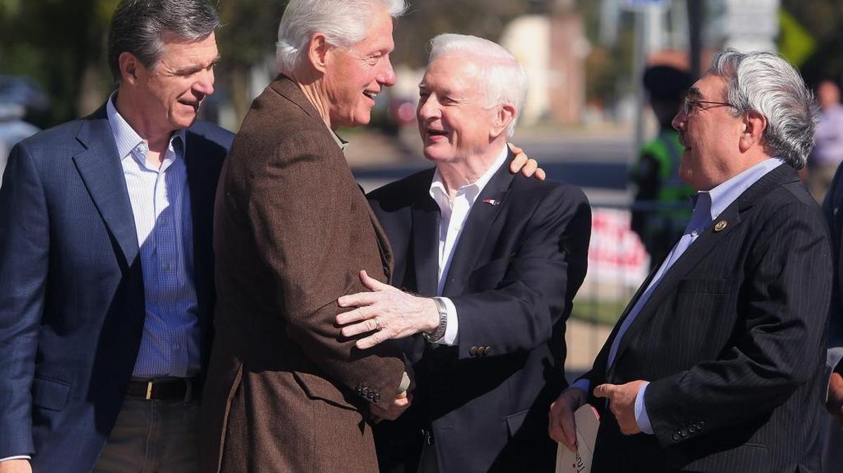 In this Oct, 25, 2016 file photo, former President Bill Clinton, second from left, greets former North Carolina Gov. Jim Hunt, second from right, U.S. Rep. G.K. Butterfield, D-1st District, right, and then-North Carolina Attorney General Roy Cooper during a rally, while campaigning for Democratic presidential nominee Hillary Clinton. The four-term Democratic governor is among the state's most influential politicians of the 20th century, but remains engaged in 21st century policy and politics as he turned 80 years old in May. (Alan Campbell/The Rocky Mount Telegram via AP, File)