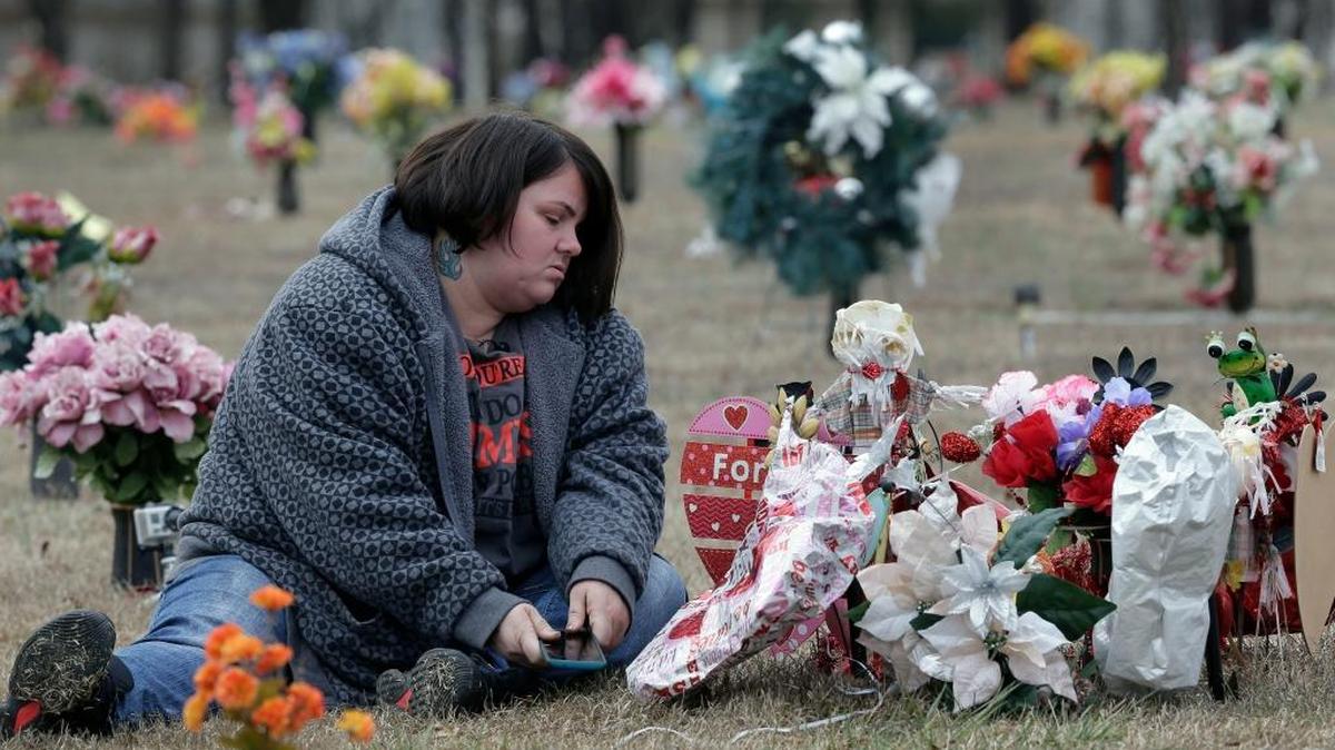 Amy Pittman visits the grave of her son, Christian, in Durham on Feb. 10, 2017. Pittman was charged in 2014 with manslaughter after 9-year-old Christian was accidentally shot and killed by his older brother.