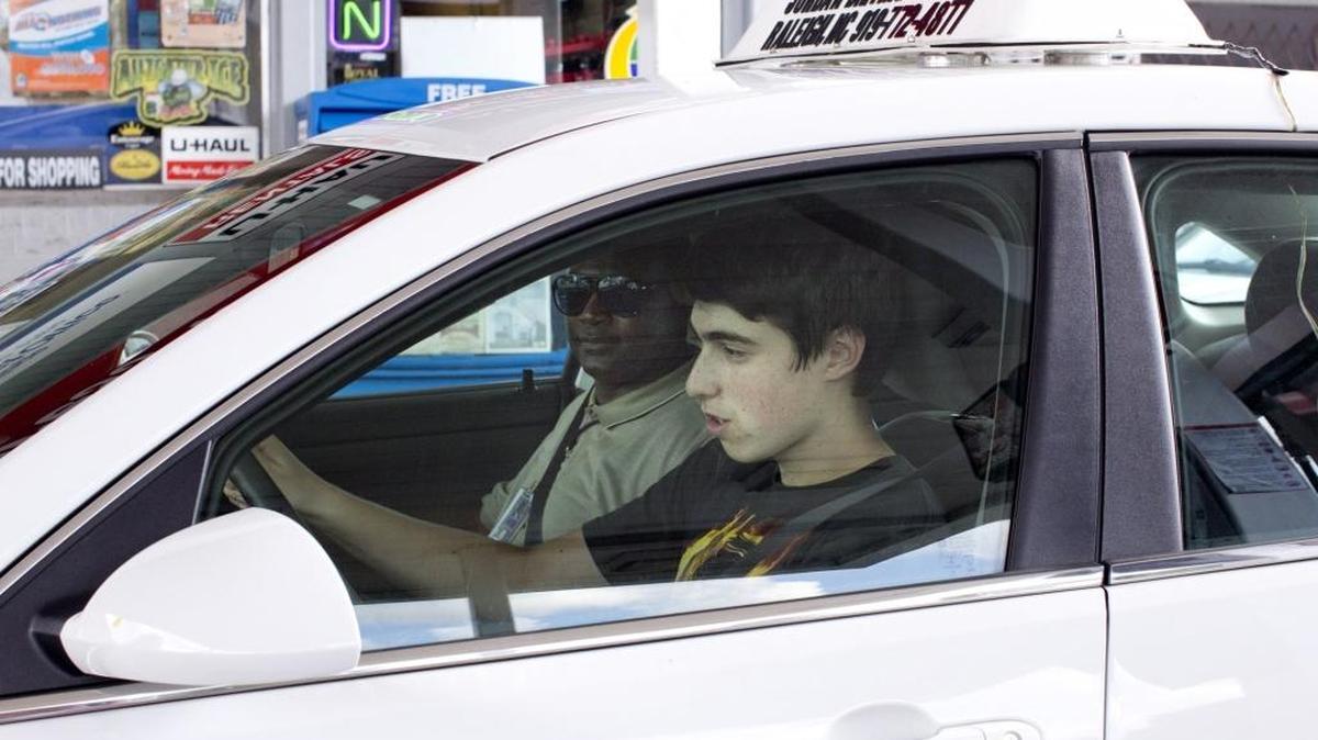 Asher Philips, 15, runs through a driving checklist alongside of instructor Curtis Wilson during the the behind-the-wheel portion of the driver's education program on Aug. 19, 2015 in Raleigh.
