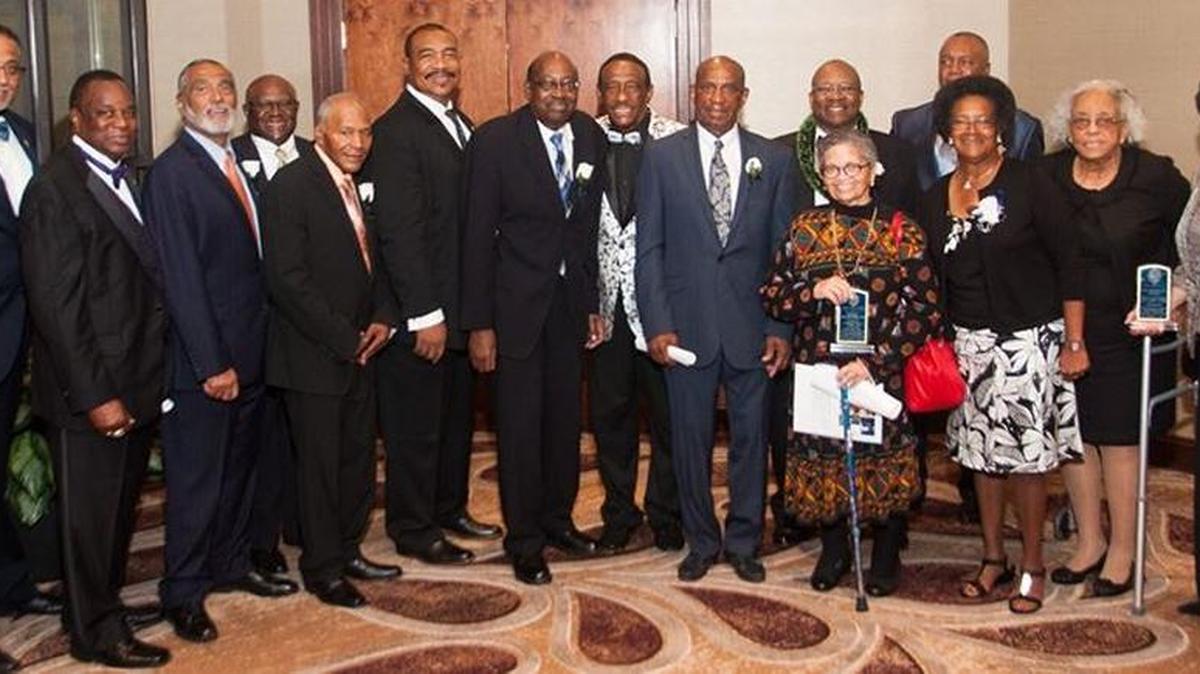 Front Row: Dr. F. Vincent Allison (immediate past president); Frederick S. Brown (president), Augustus Thompson, Jr.; Albert “Blood” Daniels; Craig Umstead; Silas Mayfield; Harrison “Bud” Lyon, Brenda Armstrong, M.D.; Bonnie Logan; Colonel Herbert Parker’s wife and daughter, Florida Fisher Parker and Christie P. Smith] Back Row: Lee Johnson, Jr.; Apostle Donald Fozard, Sr.; Herman “Little G” Graham Jr.; Thomas “Hawk” Long, Jr.